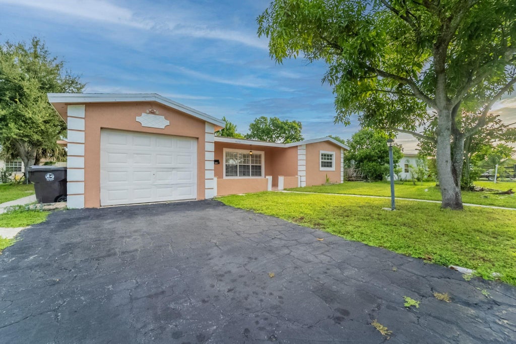 Photo of 4655 NW 41st Place, Lauderdale Lakes, FL 33319 (MLS # F10523373)