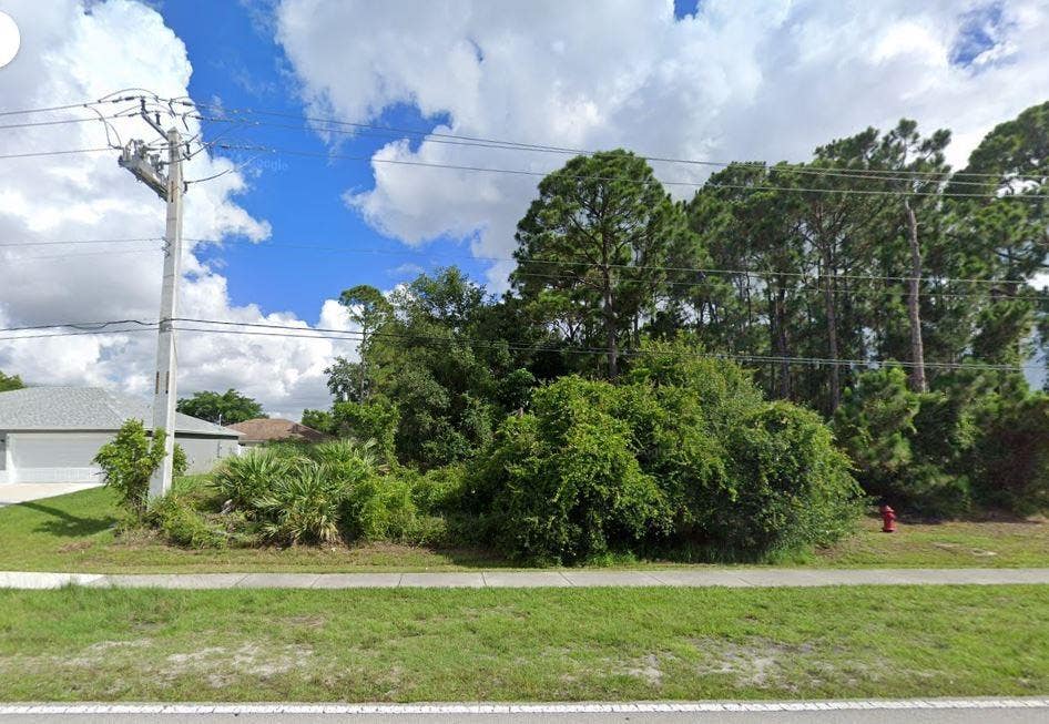 Photo of 807 SW California Boulevard, Port Saint Lucie, FL 34953 (MLS # F10482012)