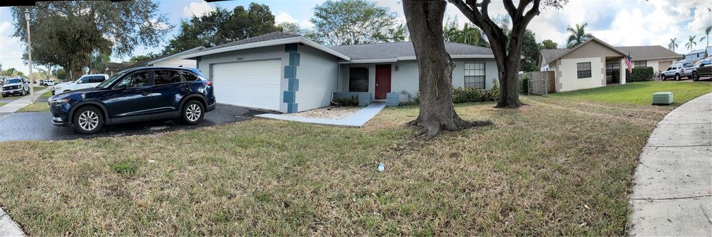 Photo of 12900 SW 13th Manor, Davie, FL 33325 (MLS # F10538858)
