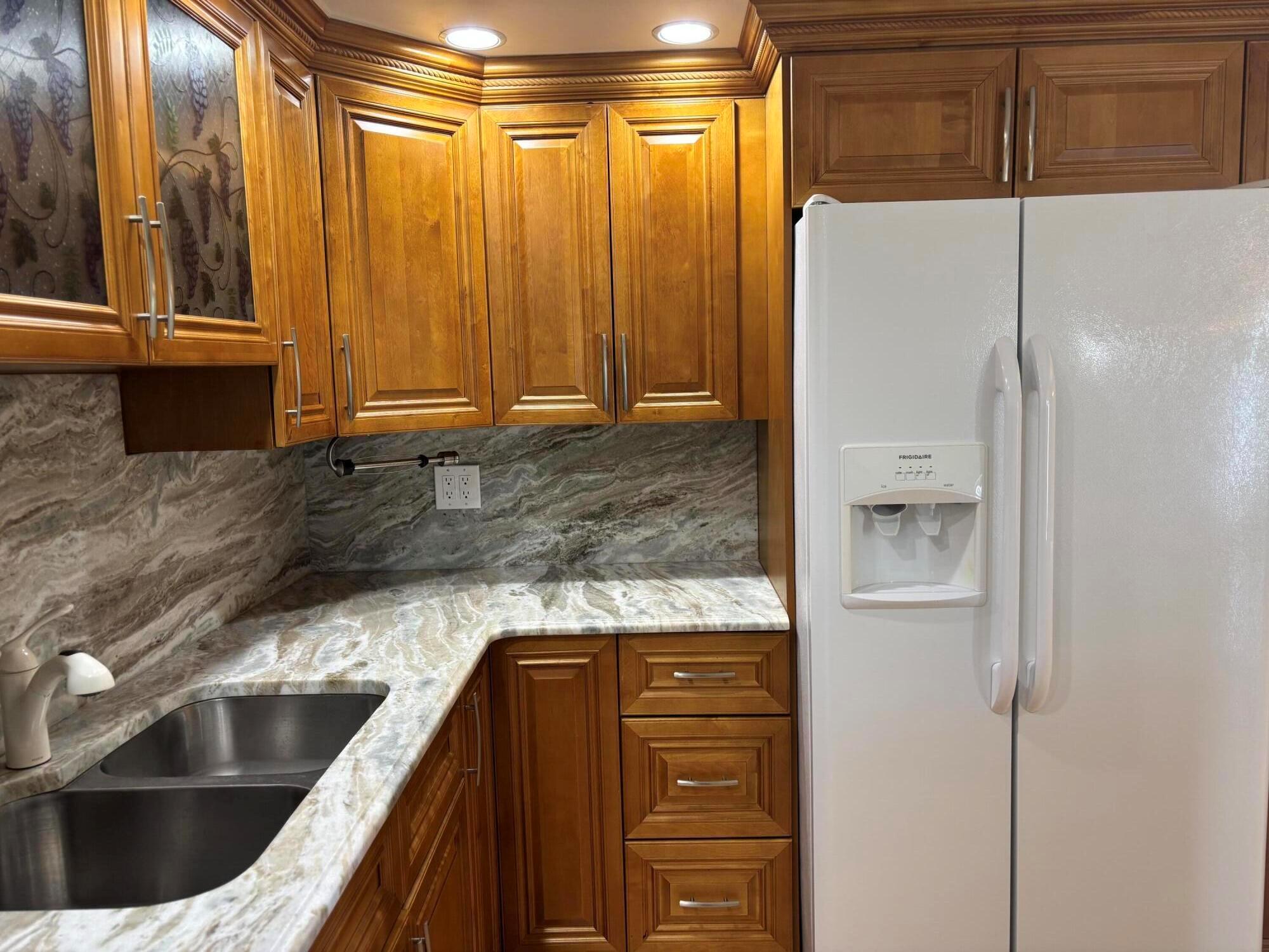 GORGEOUS WATER VIEW FROM BOTH BEDROOMS!! THIS 2 BEDROOMS, 2 BATHS CONDO IN AN EXQUISITE 55 PLUS COMMUNITY IS IN READY MOVE-IN CONDITION. INCLUDES HURRICANE WINDOWS AND A MURPHY BED IN GUEST ROOM ALLOWING FOR THAT SPACIOUS LOOK UPON ENTERING. WALK IN CLOSET IN MASTER BEDROOM.BEAUTIFUL KITCHEN WITH DOUBLE SINKS. COME AND ENJOY THIS WONDERFUL FRIENDLY COMMUNITY WITH ITS 12 SWIMMING POOLS, TENNIS COURTS, FITNESS FACILITY, 1200 SEAT CLUBHOUSE THEATER AND MUCH MORE. GREAT OPPORTUNITY TO ENJOY THIS LUXURIOUS LIFESTYLE!!