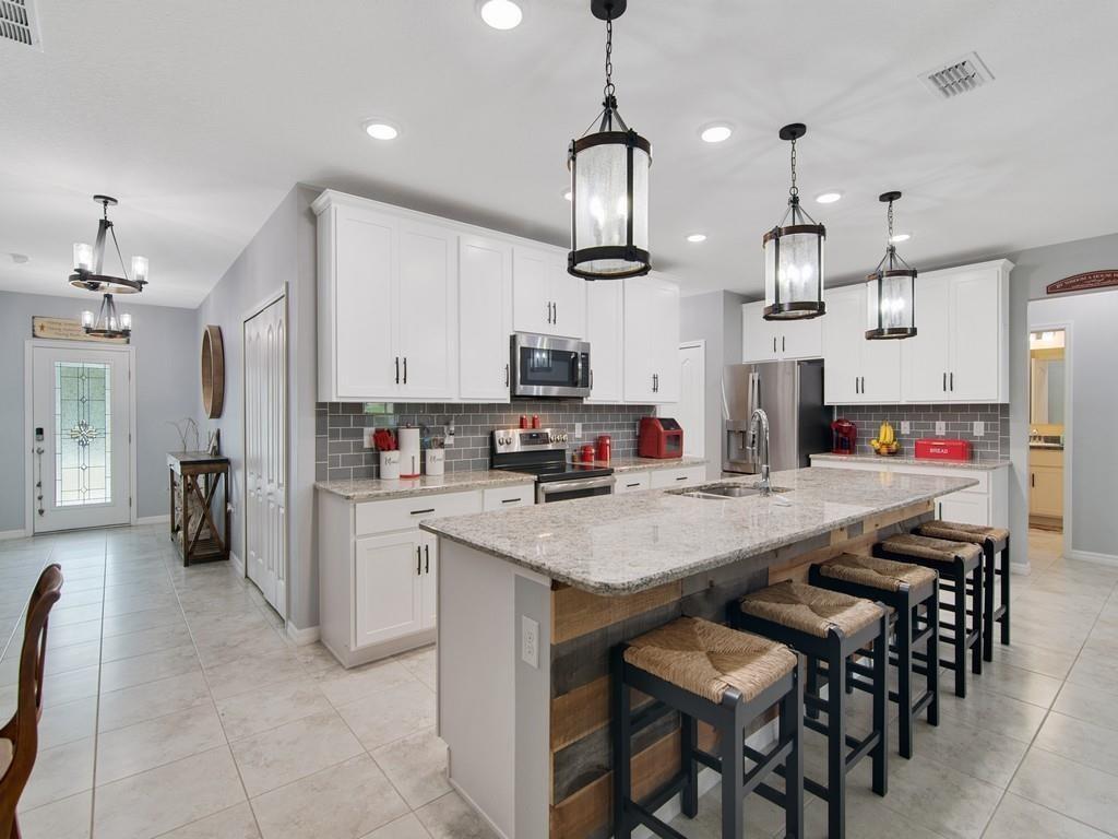 Unfurnished rental now available. Looking to get away from it all and still be close to town? Then this is it! 2020 build with 4 bed/3 bath/3 car garage, open concept w/granite counters, SS appliances, impact windows, plantation shutters, air-conditioned garage, screened in lanai, ship-lap walls & island, tile & wood floors throughout, serene fenced in backyard w/fire pit, room to garden & roam, & NO HOA. Brand new air & water purification system for the whole house. Bring all the toys and enjoy country living at its finest! Pet friendly.