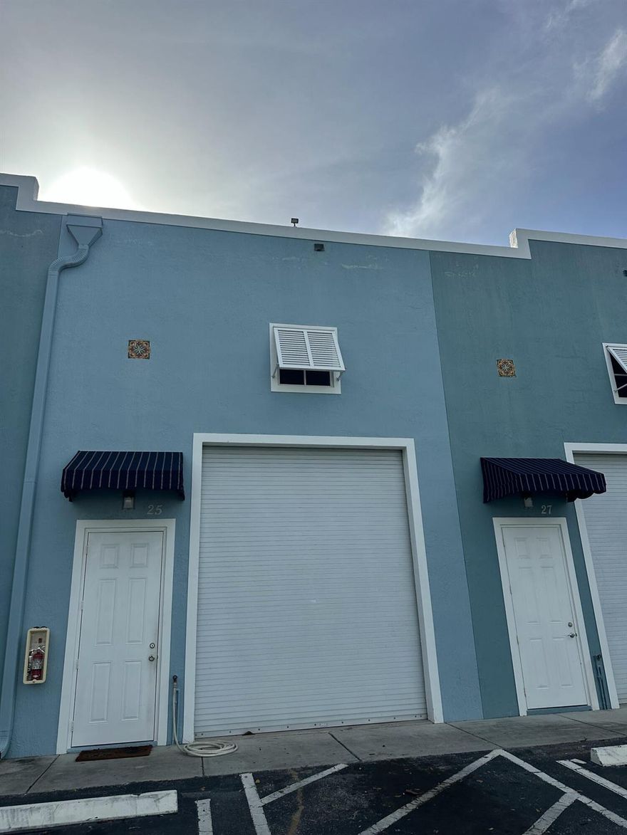 Warehouse space Ideal for small business or storage needs for auto, boat, work equipment. CBS construction with 22 ft. ceilings. Fully air conditioned with large 12 ft rolling garage door and fenced yard. Contains very large loft space for additional use.