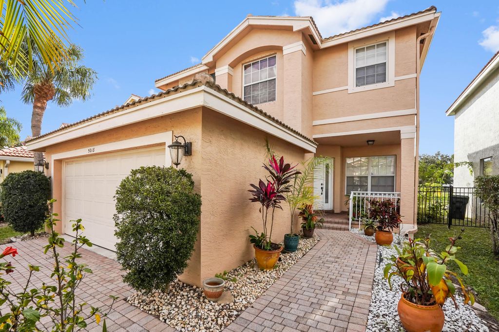 Photo of 5018 Starblaze Drive, Greenacres, FL 33463 (MLS # R11154041)