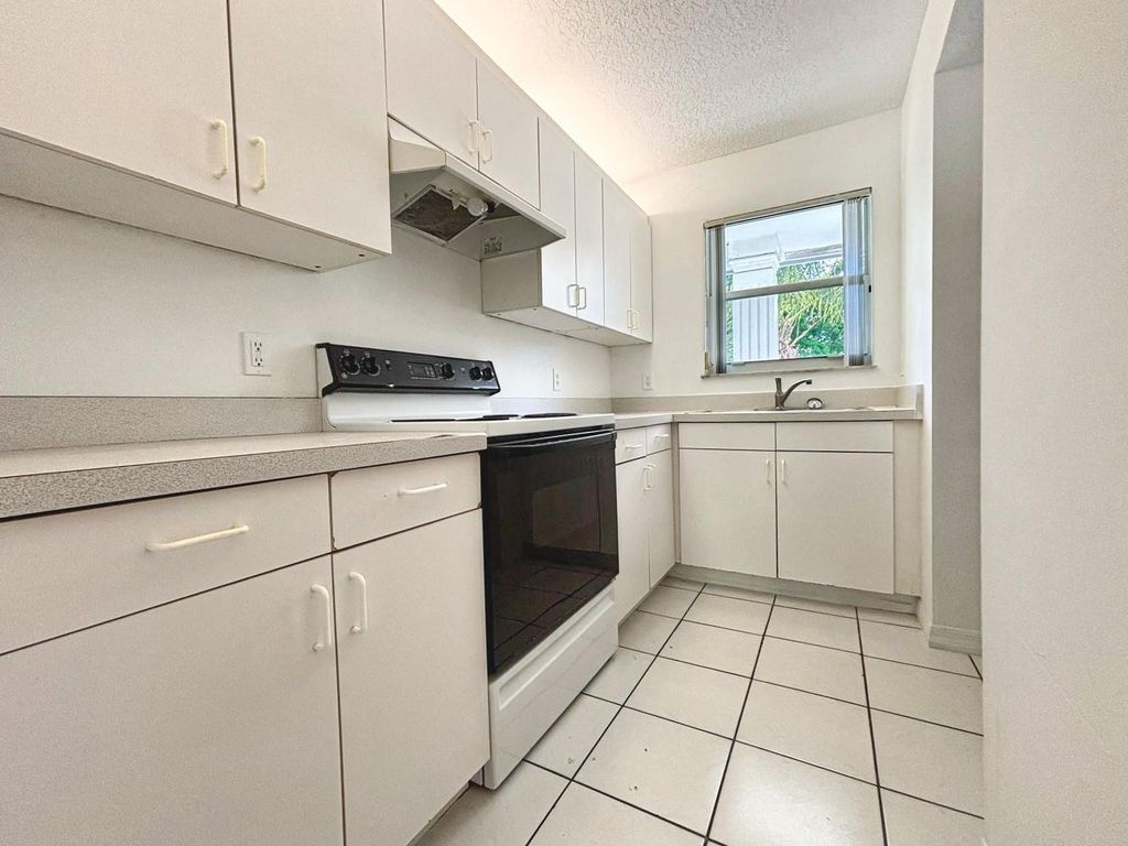 Photo of 9013 NW 38th Drive #102, Coral Springs, FL 33065 (MLS # F10516218)