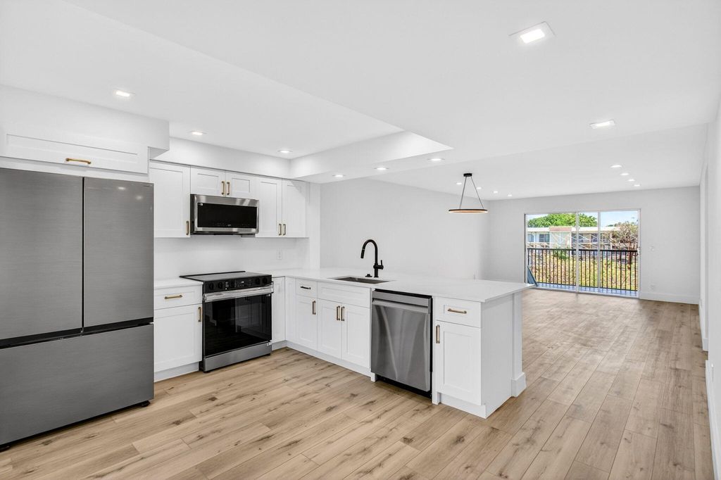 Photo of 14360 Strathmore Lane #406, Delray Beach, FL 33446 (MLS # B26014077)