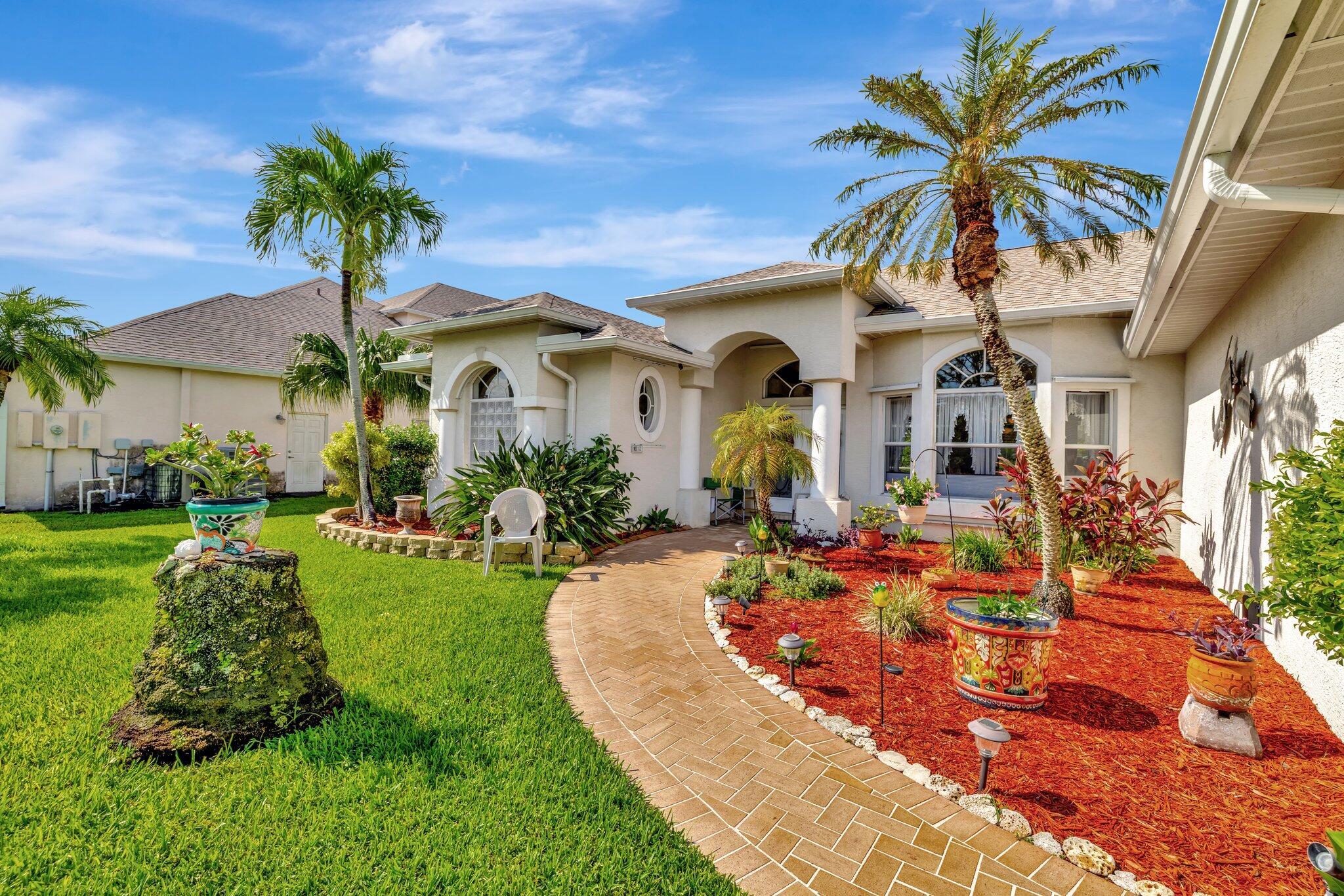 Spectacular POOL home on C-24 Canal with DOCK. This beautiful home was built by GEM.The Home has been well maintained by owner. This is what Florida is all about, step out to enjoy the large Screened lanai with pool with stunning view of canal. This home features a split bedroom plan. Formal dining & Living Room plus Family Room, Large Eat-in Kitchen with granite counters & Stainless-Steel Appliance. Separate Laundry Room with sink & 2 Car Garage Complete Furnished Garage Screen door 2023, Pool Pump 2024. New air condition 2024, Sprinkles in front 2024, Gutters 2023, Water Heater 2019. Jet skis & Motorboats are welcome here with 20 miles of wide canal to explore. roof is 2023, solar heats pool & Hurricane Shutters enclosed the Lani home. Close to I-95 & Turnpike for easy commute.