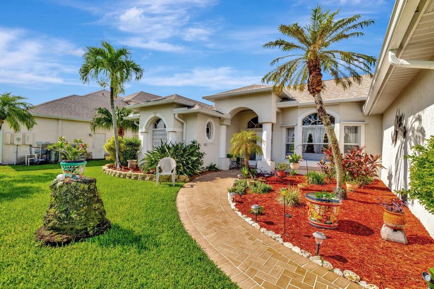 Spectacular POOL home on C-24 Canal with DOCK. This beautiful home was built by GEM.The Home has been well maintained by owner. This is what Florida is all about, step out to enjoy the large Screened lanai with pool with stunning view of canal. This home features a split bedroom plan. Formal dining & Living Room plus Family Room, Large Eat-in Kitchen with granite counters & Stainless-Steel Appliance. Separate Laundry Room with sink & 2 Car Garage Complete Furnished Garage Screen door 2023, Pool Pump 2024. New air condition 2024, Sprinkles in front 2024, Gutters 2023, Water Heater 2019.  Jet skis & Motorboats are welcome here with 20 miles of wide canal to explore. roof is 2023, solar heats pool & Hurricane Shutters enclosed the Lani home. Close to I-95 & Turnpike for easy commute.
