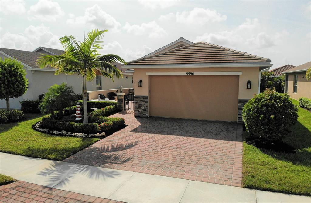 Photo of 9996 SW Trumpet Tree Circle, Port Saint Lucie, FL 34987 (MLS # R10750922)