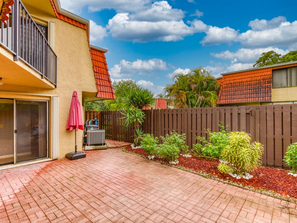 Photo of 23078 Oxford Place #Apt D, Boca Raton, FL 33433 (MLS # B26070952)