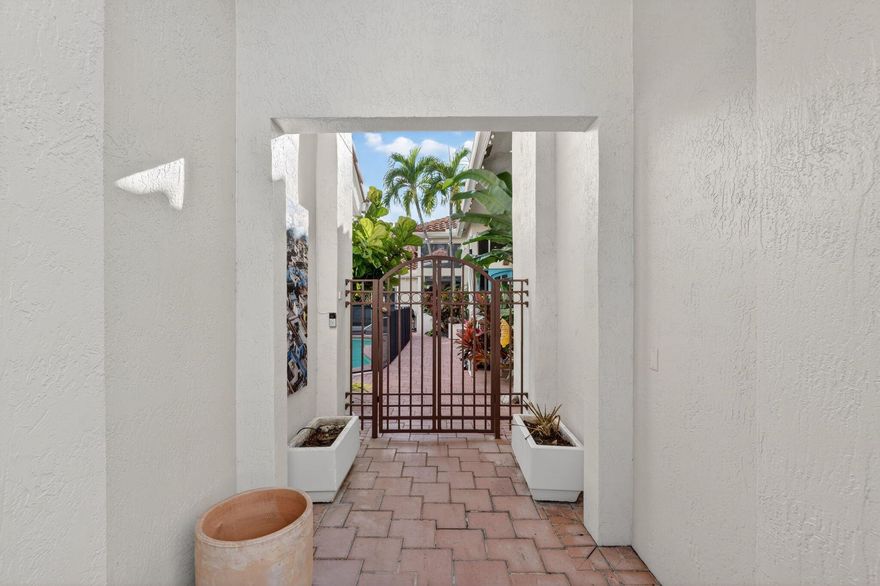 Welcome to this beautiful courtyard home in Boca Grove. Situated on a charming cul-de-sac, this residence offers 4 bdrms and 3.5 baths, raised ceilings with abundant natural light, newly renovated primary bathroom, new flooring, and a new beautiful kitchen. A standalone guest house enhances the property, complete with a private bedroom and full bath. Centrally located, just a short walk to the clubhouse, fitness center, tennis, pickle, padel, golf, playground, resort-style pool, and houses of worship.