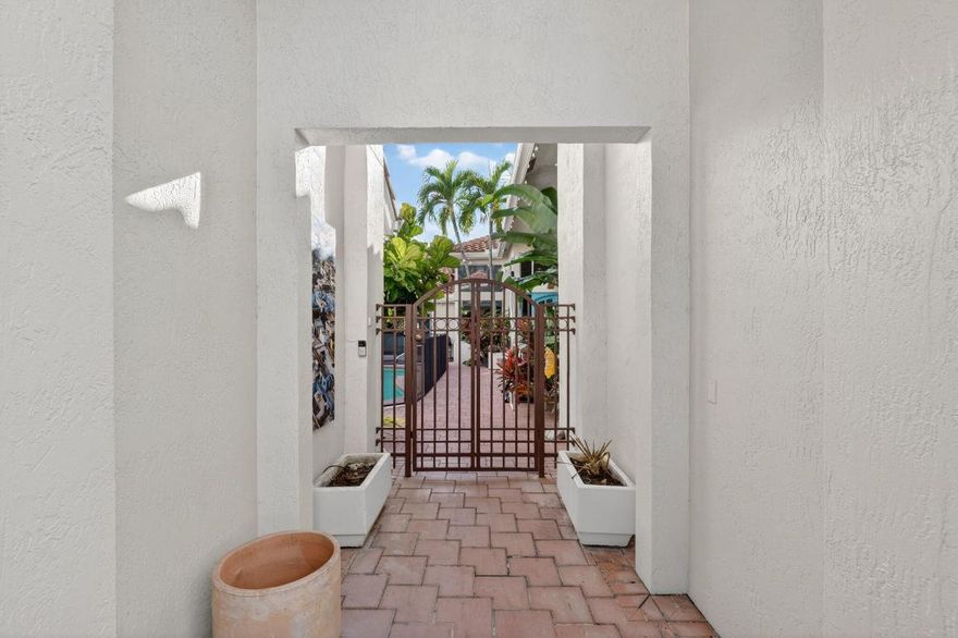 Welcome to this beautiful courtyard home in Boca Grove. Situated on a charming cul-de-sac, this residence offers 4 bdrms and 3.5 baths, raised ceilings with abundant natural light, newly renovated primary bathroom, new flooring, and a new beautiful kitchen. A standalone guest house enhances the property, complete with a private bedroom and full bath. Centrally located, just a short walk to the clubhouse, fitness center, tennis, pickle, padel, golf, playground, resort-style pool, and houses of worship.