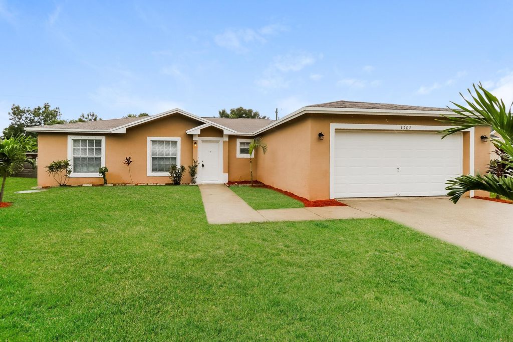 Photo of 1302 SW Amboy Avenue, Port Saint Lucie, FL 34953 (MLS # R11027509)