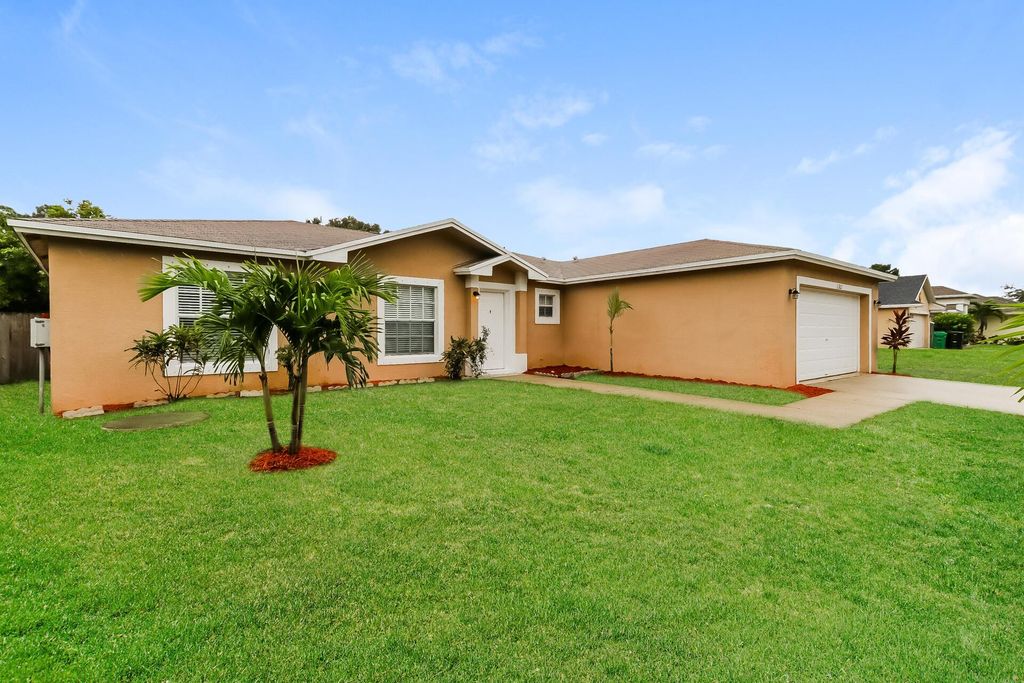 Photo of 1302 SW Amboy Avenue, Port Saint Lucie, FL 34953 (MLS # R11027509)