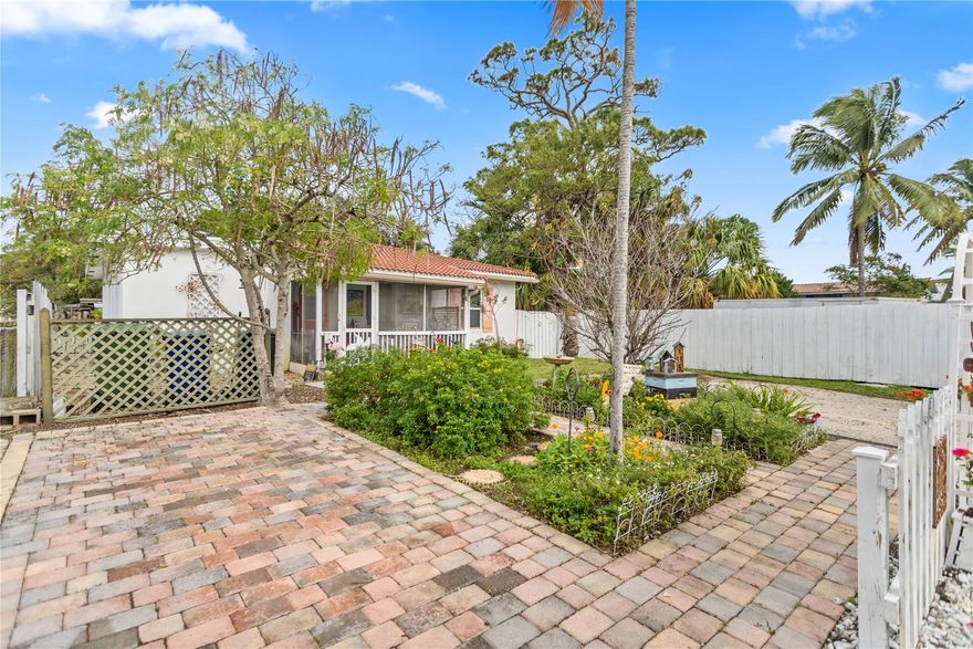Lowest price per sq foot in Croissant park. Key West style bungalow in walking distance of local restaurants and downtown Ft Lauderdale. DOUBLE LOT property in elite location and so much charm! Detach garage can be finished to a in-law suite or pool house. High impact windows, crown molding, 2015 roof, electric and plumbing plus 2020 a/c. Recent add on makes this a true 2/2. You’ll walk through the quaint dining and living room space, through a galley kitchen to outside expansive, secluded oasis. Full of Florida tropical plants & plenty of space for gathering. A wood fire pizza oven accompanies the deck. This private getaway is an ideal starter home, second home or an INVESTORS DREAM with no HOA and competitive rents. 10 minutes to the beach.