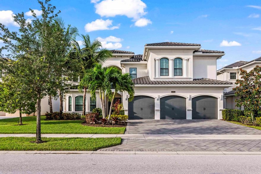 Perched on a picturesque lakefront lot with mesmerizing fountain views, this impeccably designer-decorated Bassano Grande spans nearly 6,000 square feet of luxurious, modern living. The backyard is an entertainer's paradise, featuring a screened, heated saltwater pool and spa, an outdoor TV, and a fully equipped summer kitchen with a brand-new premium grill. Inside, sophisticated high-end finishes elevate every detail, complemented by a state-of-the-art media room, a built-in office, and rich woodwork throughout. The primary suite serves as a private sanctuary, boasting his-and-hers bathrooms, custom closets, a cozy sitting area, and an exclusive balcony. Additional highlights include spacious oversized bedrooms, elegant lighting, custom window treatments, newly upgraded garage flooring,