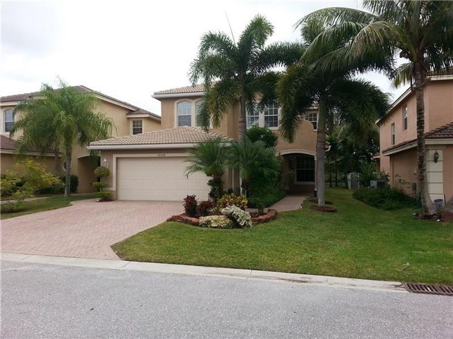 Gorgeous 5 bedroom, 3 bath home located in one of West Boynton's most desirable familycommunities, Canyon Lakes. Many amenities and upgrades to show, including wet bar in living room andexceptional new wood floors throughout the home. Completely remodeled kitchen. New hurricane high-grade impact windows. Custom built-ins in all bedroom closets. Jacuzzi tub in master bathroom. Screened in pool and patio with tremendous privacy in back yard. Must see.