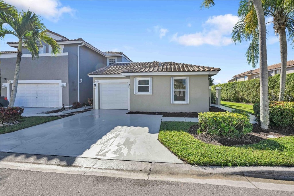 Photo of 11766 NW 57th Street, Coral Springs, FL 33076 (MLS # F10530100)