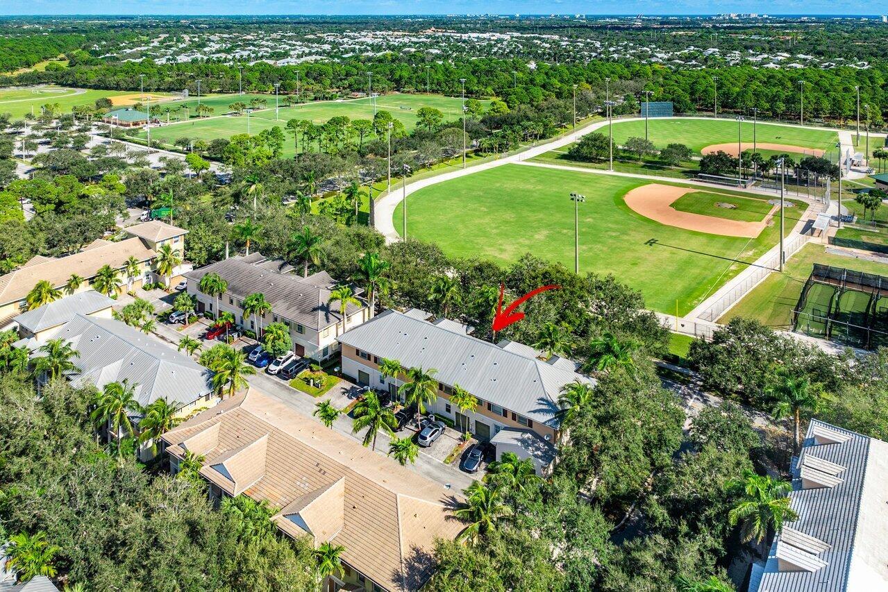 Stunning corner unit in Antigua at Abacoa....This beautifully maintained 2-story townhome is ideally located across from the ballpark in the highly sought-after Antigua community in Abacoa. Featuring 3 spacious bedrooms, 2.5 bathrooms, and a 1-car garage, this home combines comfort and convenience in one of Jupiter's most desirable areas. Inside, enjoy rich wood floors, elegant plantation shutters, and an inviting eat-in kitchen, along with a convenient guest bath downstairs. Upstairs, the home boasts three generously sized bedrooms, including a master suite with a private balcony, perfect for relaxing. The home includes upgraded accordion shutters and a recently replaced A/C unit (2018). With a prime location near Abacoa Community Park....