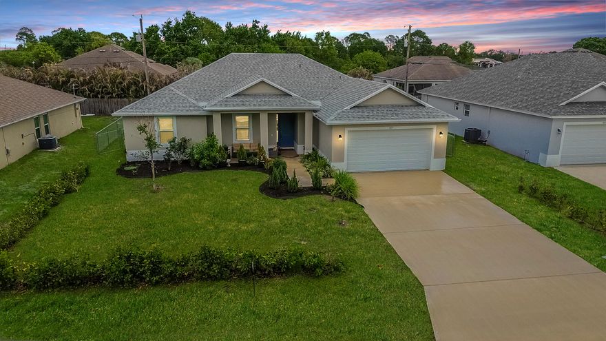 Welcome to your brand-new sanctuary! This stunning 2024 4/2.5/2 CBS home  offers the perfect blend of modern elegance and functional design. Boasting an open-concept layout with luxurious wood look tile floors, tray ceilings that creates an airy, light-filled atmosphere. The gourmet kitchen, complete with granite counters, 42" wood cabinets and stainless appliances and pantry, flows seamlessly into the living and dining areas, making it ideal for entertaining. Enjoy the Florida lifestyle on your covered patio with plenty of room for a pool. Additional highlights include impact glass throughout for ultimate storm protection, a split-bedroom floor plan for privacy with walk in closets, a luxurious master suite with a Roman tub and dual sinks.  This move-in-ready gem is waiting for you!