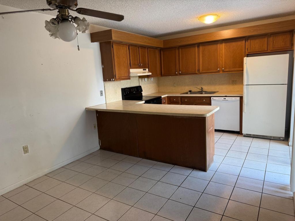 Photo of 5818 SE Windsong Lane #212, Stuart, FL 34997 (MLS # R11125419)