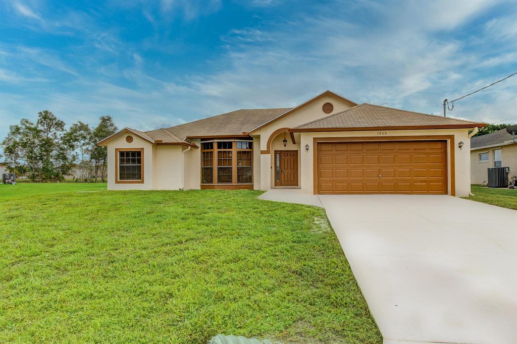 Photo of 5860 NW Dunmore Avenue, Port St Lucie, FL 34986 (MLS # R10898652)