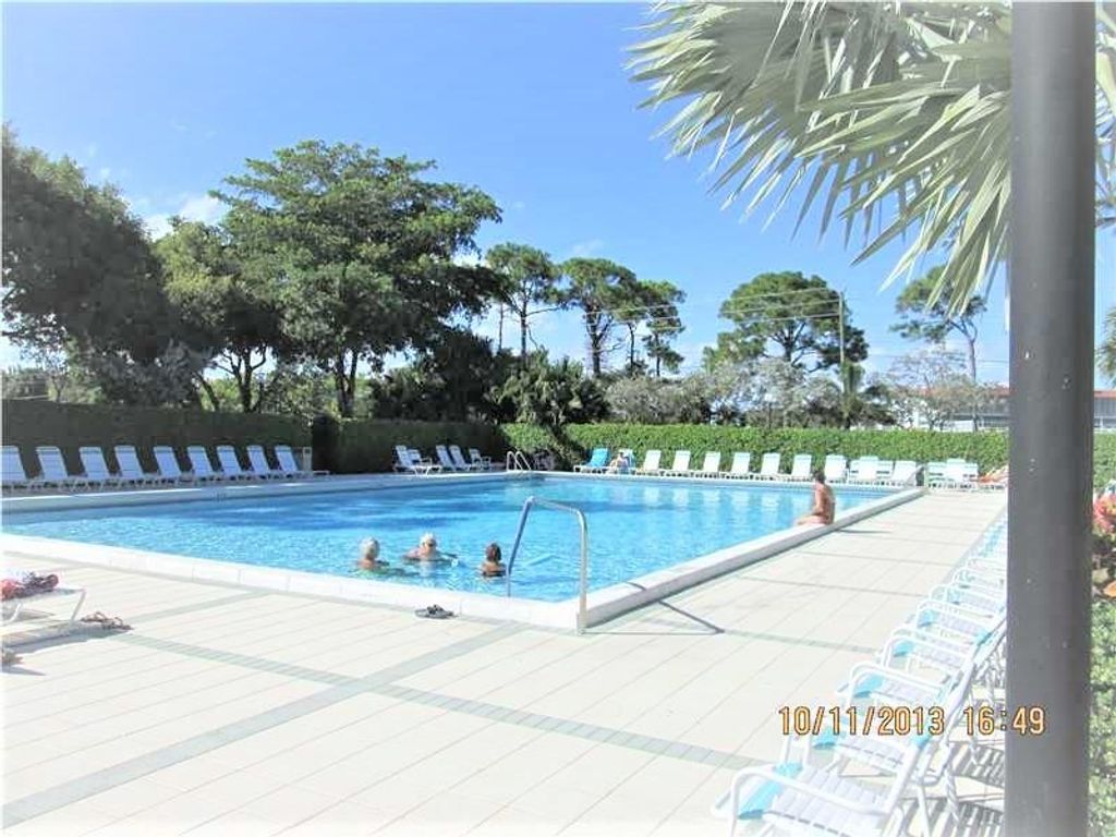 Photo of 2240 N Cypress Bend #104, Pompano Beach, FL 33069 (MLS # F10478605)