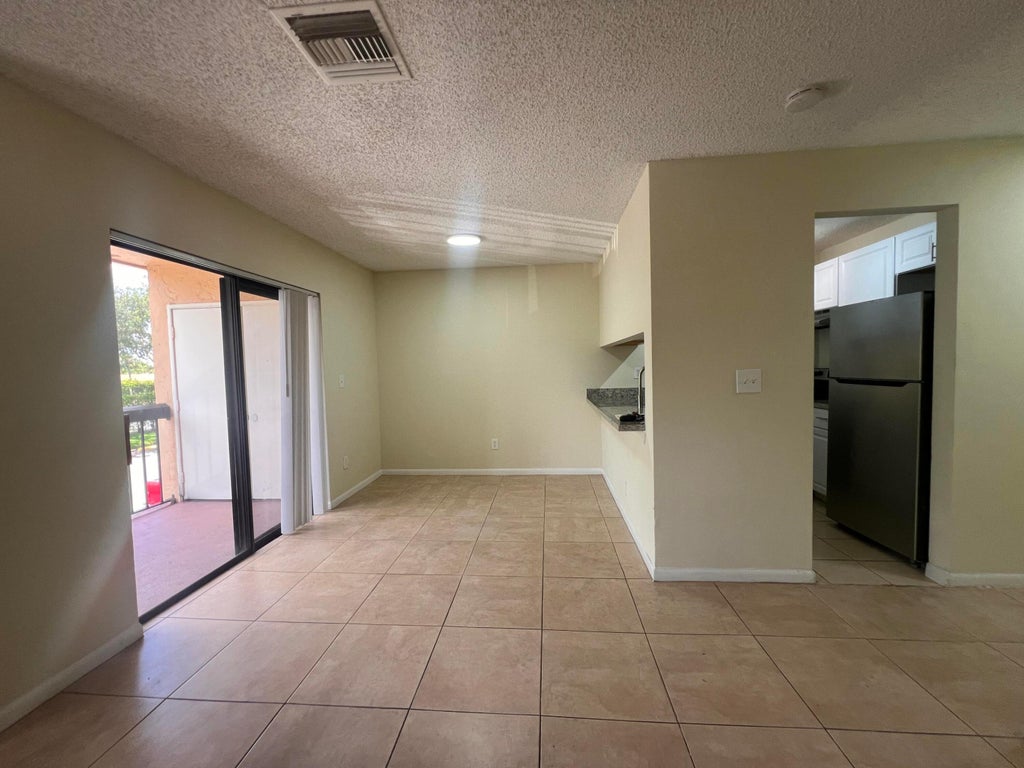 Photo of 6061 N 10th Ave Avenue N #242, Greenacres, FL 33463 (MLS # B26040963)