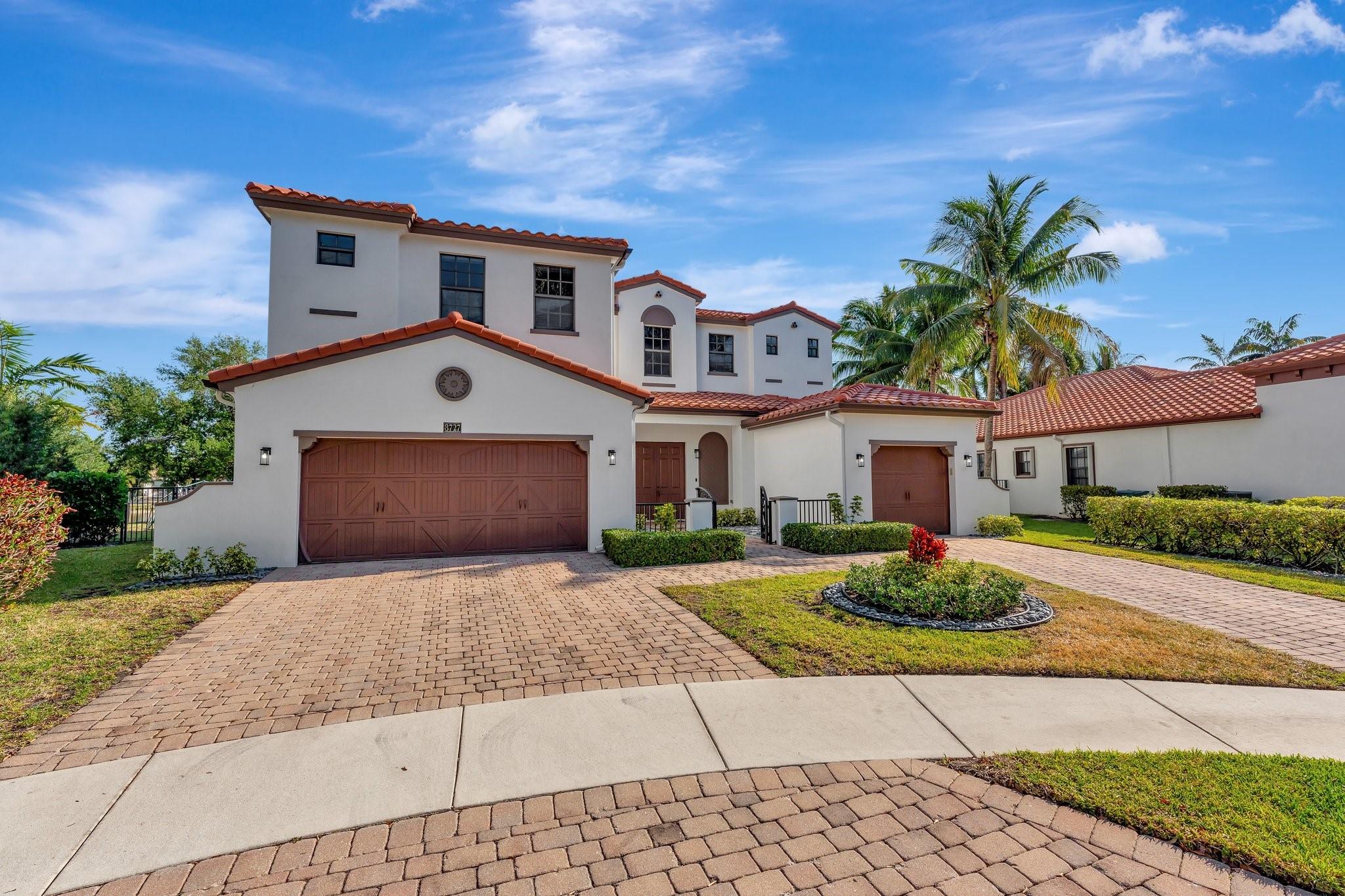 Spectacular, Le Verona Model home with recently renovated salt-water pool & spa, is nestled in the coveted & gated community of Estada. From the welcoming courtyard entrance to the tranquil water's edge, this lovely home features 3 master suites! Flooded with natural light, this spacious home presents soaring ceilings & diagonal marble and hand scraped wood floors. Other features include a huge primary suite with walk-in closets & a large bath w/vanity & jacuzzi, impact glass, and a state-of-the-art open kitchen w/ double wall ovens. 3 A/C units w/ UV light cleaners provide optimal climate control. A+ schools! Located in a quiet community and situated across from a newly updated private play park, this unique home offers an exquisite living experience, and the very best of South Florida!