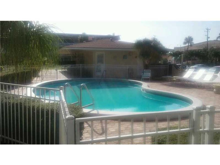 2/2 corner unit in highly desirable North Hampton Court! Largest floor plan in complex!  Ground floor unit with screened-in porch!  Close-knit 55 and over community! Can be rented annually after 1st year of ownership! Listing price reflects unit needing T LC!