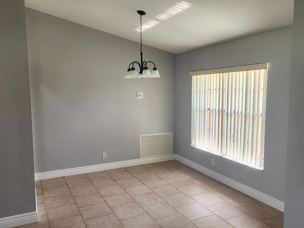 Photo of 425 SW Mccomb Avenue, Port Saint Lucie, FL 34953 (MLS # B26042448)