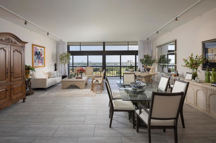 Magnificent lake, golf course and ocean views are the most fabulous features of this spectacular penthouse residence. It offers 10-foot ceilings, floor-to-ceiling windows, two large bedrooms with spacious en-suite bathrooms, an open gourmet kitchen with specimen granite countertops, stainless steel appliances and a kitchen island. This just renovated designer furnished apartment presents a lovely residential experience, a very tranquil space featuring privacy with only four units on the floor.