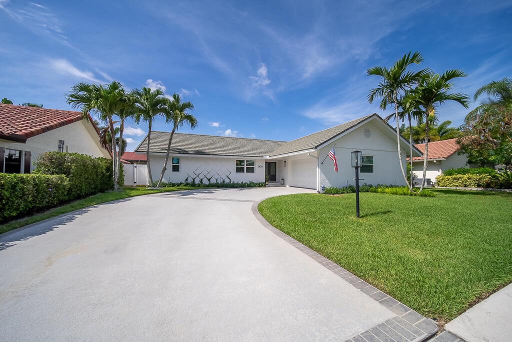 Welcome to this stunning 3 bedroom, 2 bathroom residence tucked away in a quiet cul-de-sac within the highly desirable gated community of Frenchman's Landing. This property is one of the few locations zoned as unincorporated, located in the heart of Palm Beach Gardens and just minutes from world-renowned golf courses, pristine beaches, and popular parks, as well as The Gardens Mall and other major shopping areas like Downtown at the Gardens and Legacy Place. Step inside to find a beautifully renovated interior featuring brand-new tile flooring throughout, vaulted ceilings, and hurricane impact windows and doors that offer peace of mind and energy efficiency. The split-bedroom floor plan ensures privacy, while plantation shutters in each bedroom add timeless charm and functionality.