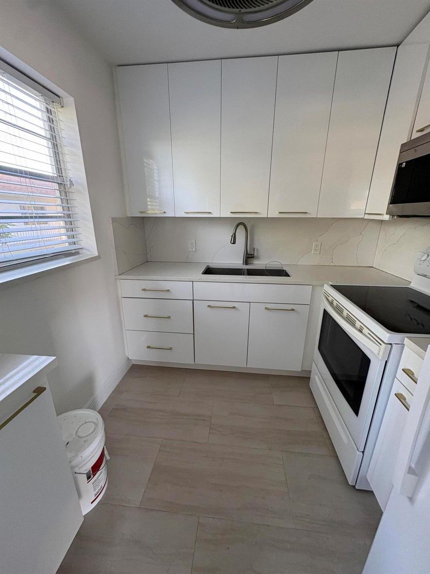 For rent in a 55 plus retirement community of Century Village in West Palm Beach a beautifully appointed 2 Bedroom, 1.5 Baths condo located on the second floor. This corner unit was freshly painted, has a new central air conditioner, nice ceramics floors throughout, updated all white kitchen with extra cabinets and a double stainless steel sink, all new bathrooms. Century Village has many amenities to offer to residents, like over a 1000 seat clubroom to watch shows and movies, indoor and outdoor pools, courtesy bus service, medical facilities, beauty shop, tennis, boating and more. Close to downtown Palm Beach, PBI airport, beaches, restaurants and houses of worship.