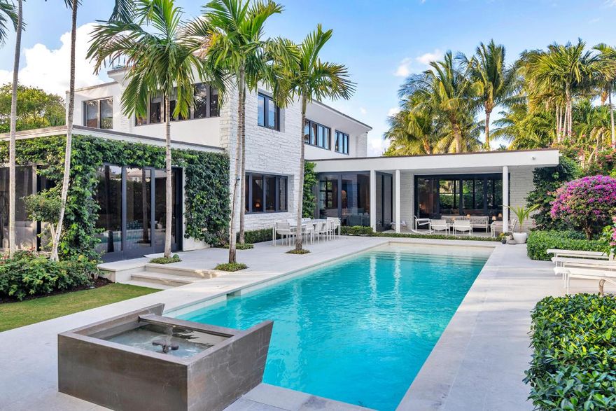 A rare offering on one of the North End's most coveted streets, this completely reimagined residence sits on an oversized lot with sunny southern exposure and light-filled, designer-decorated interiors. An expansive first floor with multiple living spaces and a ground-floor primary suite creates an ideal setting for effortless entertaining. Custom designed by renowned architect McAlpine with landscaping by Mario Nievera. Deeded beach access, Nightingale beachside cabana and direct lake trail access complete this quintessential Palm Beach luxury retreat.