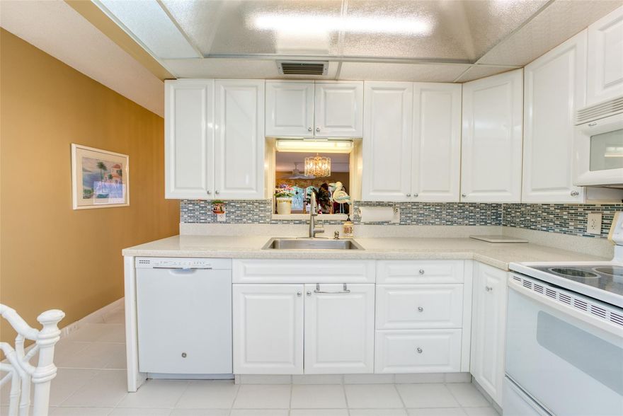 Beautiful ready to move in 2/2 unit.  AC is 2011 and water heater is 2017 and new shut off valves at the time. Electrical panel 2022Exceptional ground floor unit parking space right outside your front door. Amazing community with amazing amenities. You can golf in this beautiful golf course for only $650 a year it's fully furnished