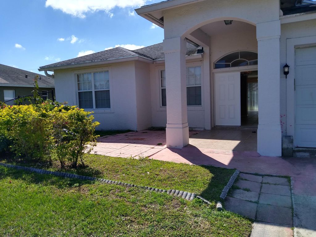 Photo of 1442 SW Dow Lane, Port Saint Lucie, FL 34953 (MLS # R10975698)