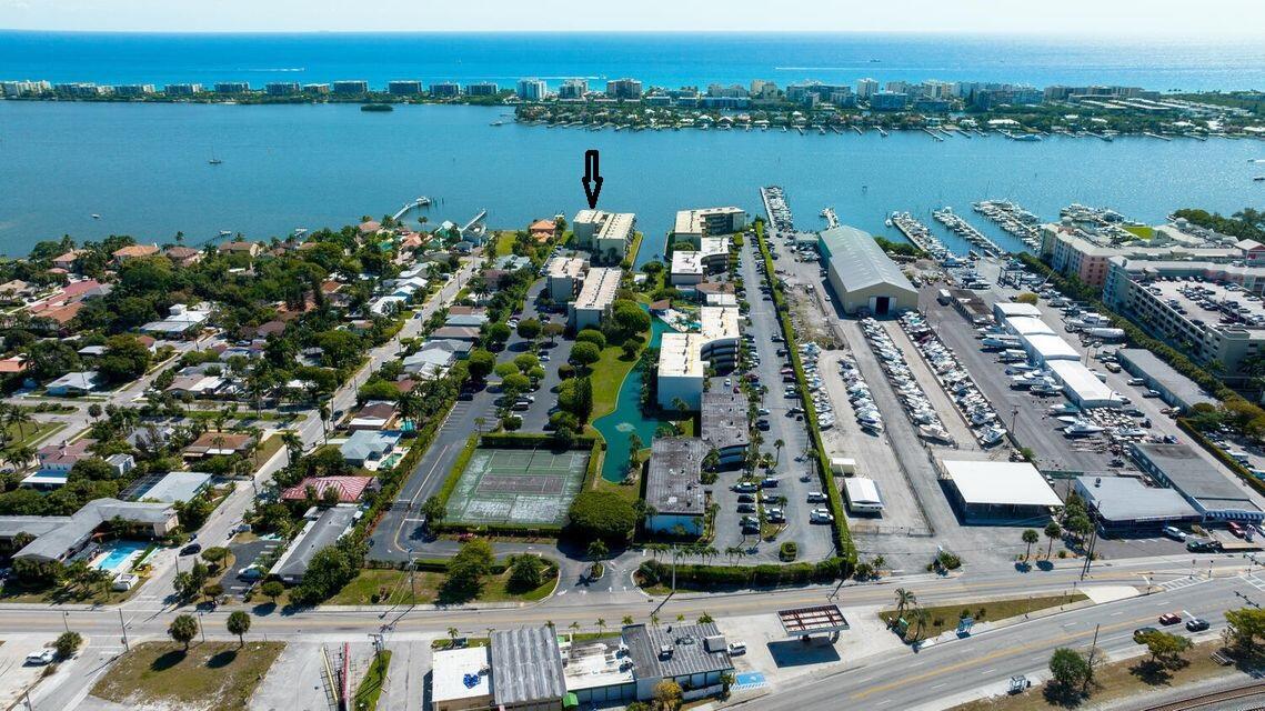 Fabulous direct Northeast intracoastal water view from this fourth-floor unit! Sit on the patio and feel the coastal breeze as you sip your coffee or tea and watch the boats go by! South Florida living at it's finest! Accordion hurricane shutters for storm protection. Carpet flooring in the main living area, with tile in the kitchen and bathrooms. Washer/dryer inside the unit! Parking space #B30. Hidden Harbour is a gated intracoastal commuity which features a pool, tennis courts, and a clubhouse with sauna, game room, library, and exercise room. Great location, just a few minutes to downtown shopping or restaurants, or to the public beach! SEASONAL RENTAL POSSIBLE! MINIMUM 90 DAY RENTAL PERIOD PER THE CONDO ASSOCIATION. MINIMUM 715 FICO SCORE, AND BACKGROUND/CREDIT CHECK REQUIRED.