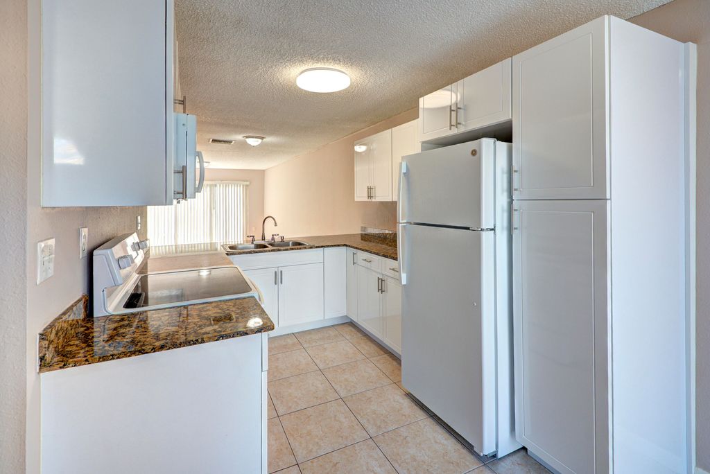 Photo of 858 Crystal Lake Drive, Deerfield Beach, FL 33064 (MLS # B26009416)