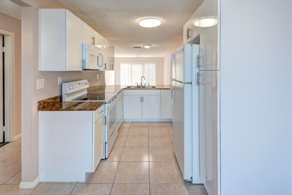 Photo of 858 Crystal Lake Drive, Deerfield Beach, FL 33064 (MLS # B26009416)
