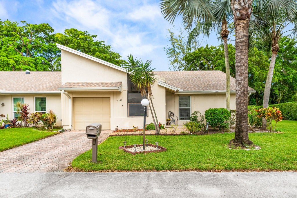 Photo of 6989 Quince Lane, Lake Worth, FL 33467 (MLS # R11137032)