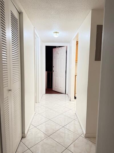 ACTIVE 55+ COMMUNITY - WATER AND CABLE INCLUDED with this 2nd floor upstairs corner unit with central a/c & BRAND NEW FLOORING! - Parking is close to stairwell - Quiet Living in SECURE MANNED GATED COMMUNITY - ALL THE AMENITIES Century Village offers are included in the rental; active clubhouse, transportation, fitness center, pools, tennis courts, social clubs, and a state-of-the-art theatre and much more!