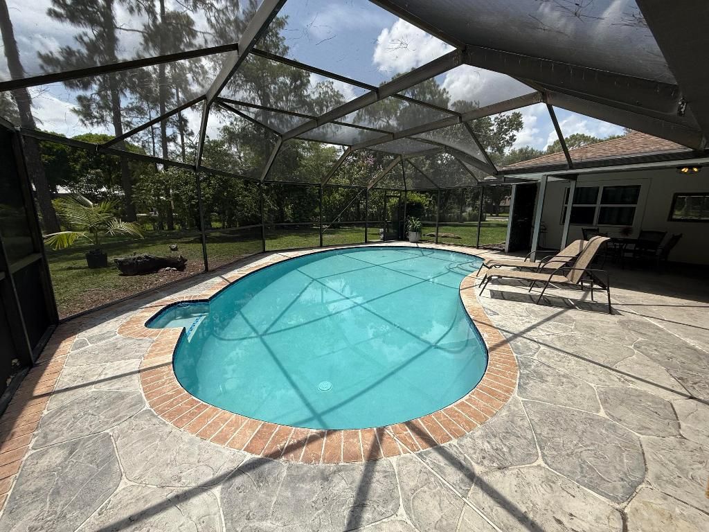 Photo of 16318 E E Pleasure Dr, Loxahatchee, FL 33470 (MLS # R11104185)