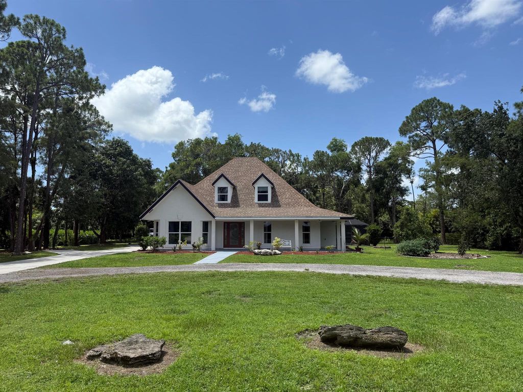 Photo of 16318 E E Pleasure Dr, Loxahatchee, FL 33470 (MLS # R11104185)