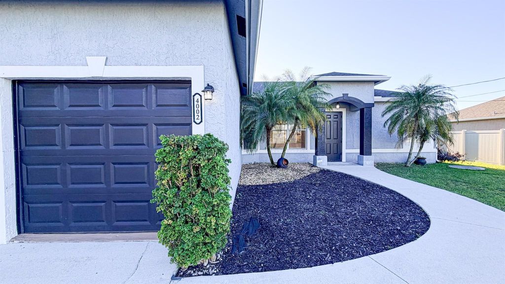 Photo of 4002 SW Jarmer Road, Port Saint Lucie, FL 34953 (MLS # R11137358)