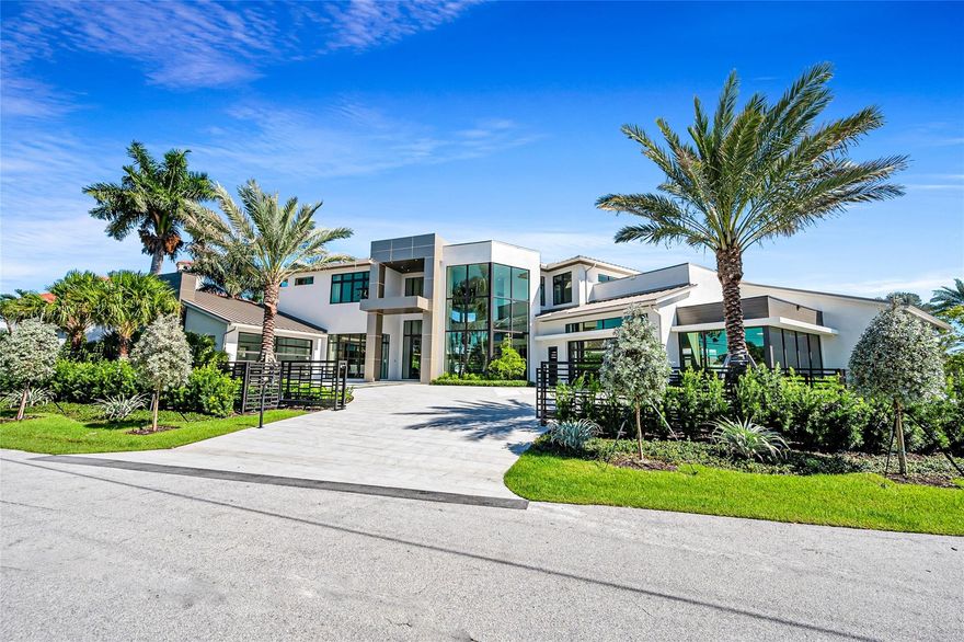 New waterfront estate spanning nearly 13,000 sq. ft. Designed for the ultimate lifestyle, it offers a 3,500 sq. ft. A/C showroom garage with space for 20 cars, a state-of-the-art gym, movie theater, and even space for a pickleball court. With 6 bedrooms and 6.2 baths, the residence features a lavish primary suite, gourmet chef’s kitchen, and a media & club room with a pub-style wet bar. High-volume ceilings, sleek modern design, and floor-to-ceiling windows showcase stunning lagoon views throughout. Outdoor living is redefined with a resort-style pool, summer kitchen, and tranquil water features. A deep-water concrete dock accommodates large yachts, all just minutes from the ocean, beaches, and airport.