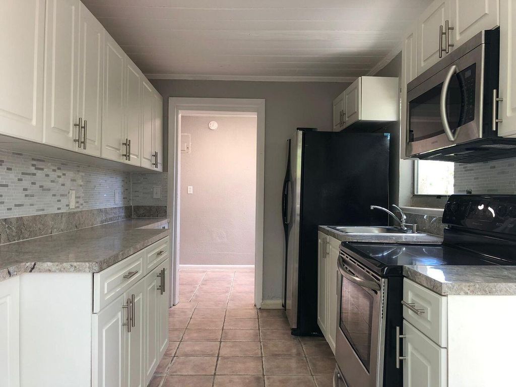 Photo of 1069 W 30th Street #6, Riviera Beach, FL 33404 (MLS # R11163616)