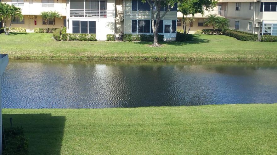 Drastically reduced! Very motivated seller & says sell now-bring best offer! Canal view from div and dining room. Beautiful, meticulously maint original owner! New wood lamin flrs t/o, new kitchen appliances, newer a/c, water heater, new toilet, shower & bathrooms, extra air ducts, rear hurricane windows on enclosed patio w/raised tile floor, w/extra storage shed, newer plantation shutters & door sliders, ceiling fan in every room! Resort style living w/3 multi-million dollar clubhouses, 8 pools,(incl 3 indoor pools), bistros, theater, gyms, golf, tennis, cards, games, club & fun! Close to historic downtown Delray Beach, w/shopping, restaurants, music, arts, culture, beaches and very short walk to places of worship! Courtesy shuttle buses to almost everywhere! Lift to 2nd floo