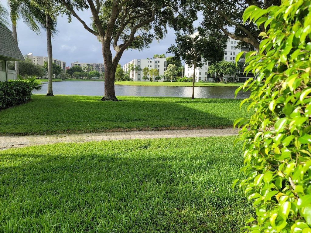 Photo of 2220 N Cypress Bend Dr #107, Pompano Beach, FL 33069 (MLS # F10401202)