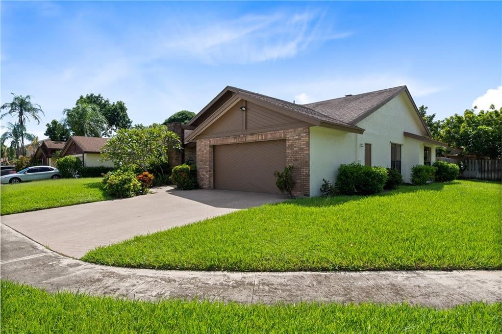 Photo of 7498 NW 49th Pl, Lauderhill, FL 33319 (MLS # F10303609)