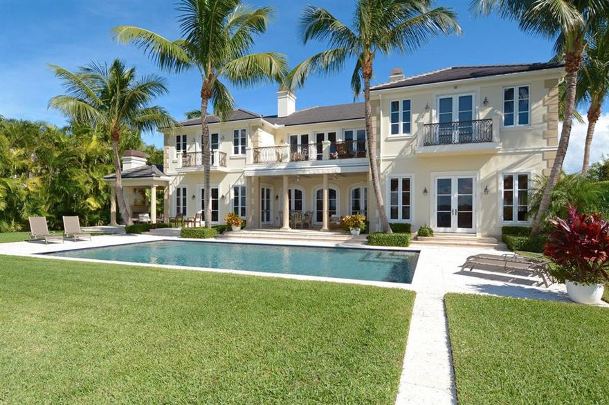 Better than new - custom built magnificent lakefront estate with stately front and rear elevation and expansive water views from virtually every room! Grand arrival through a hedged and manicured brick and pebble driveway into the expansive motor court, 3 car garage with staff, yacht captain or separate guest quarters (1 bed/1 bath) featuring a full kitchen and living area. Enter the main home and immediately breathtaking intracoastal views make the home bright and inviting from the living room, formal and informal dining, expansive family room - chefs kitchen, and library. Full master suite down & another upstairs! Elevator, gym or additional bedroom up - w/ ample additional guest bedrooms and a ''bonus'' air-conditioned third level for storage rarely seen in a Palm Beach estate residence